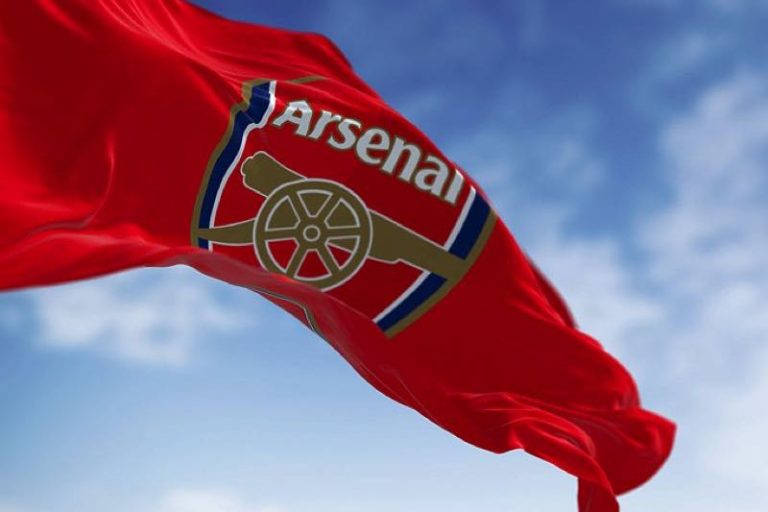 Arsenal flag waving in a blue sky